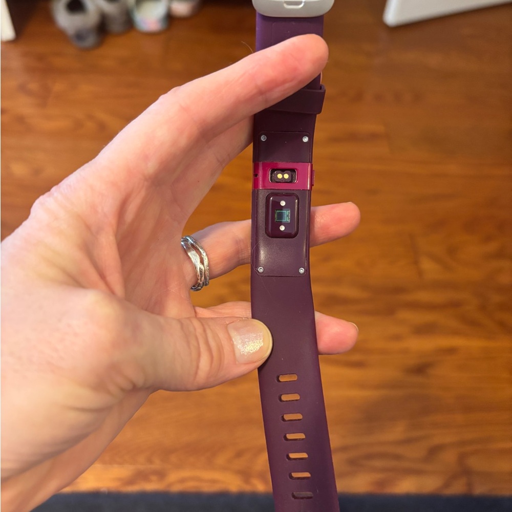 Plum colored fitness tracker